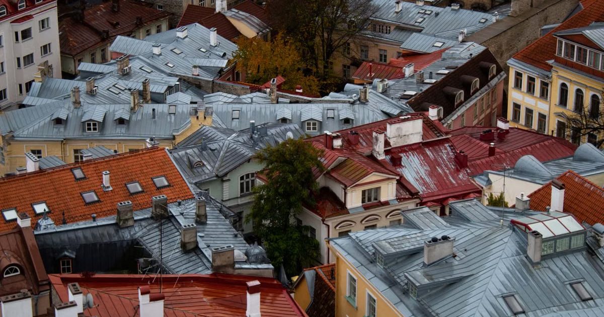 A captivating aerial shot of colorful historic rooftops in a cozy urban neighborhood during autumn.